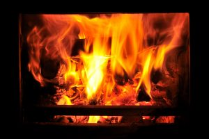 stock-photo-wood-burning-stove-with-fire-in-window-533001880